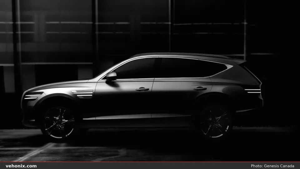 2026 Genesis GV80 in dark paint, side profile with rim lighting in a dark studio