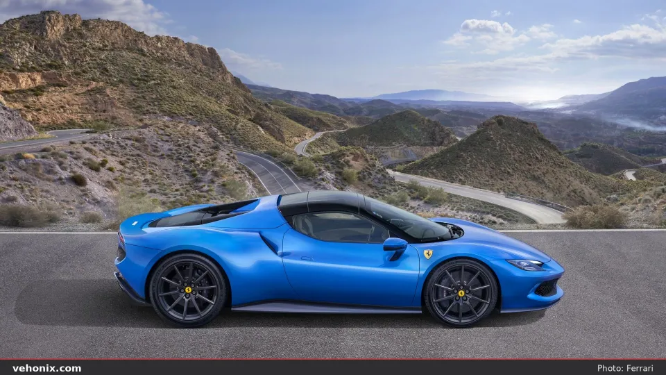 2026 Ferrari 296 GTS in Blu Corsa, side profile on a mountain road