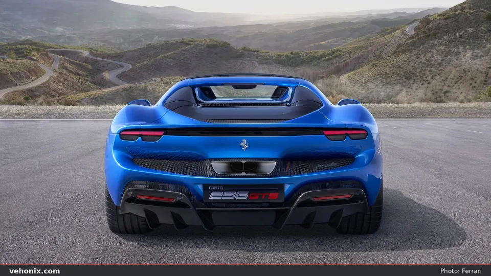 2026 Ferrari 296 GTS in Blu Corsa, rear view with mountain backdrop