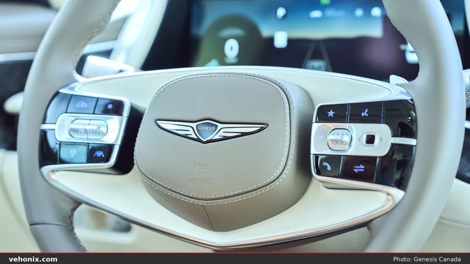 2026 Genesis G90 cream two-spoke steering wheel and digital cluster