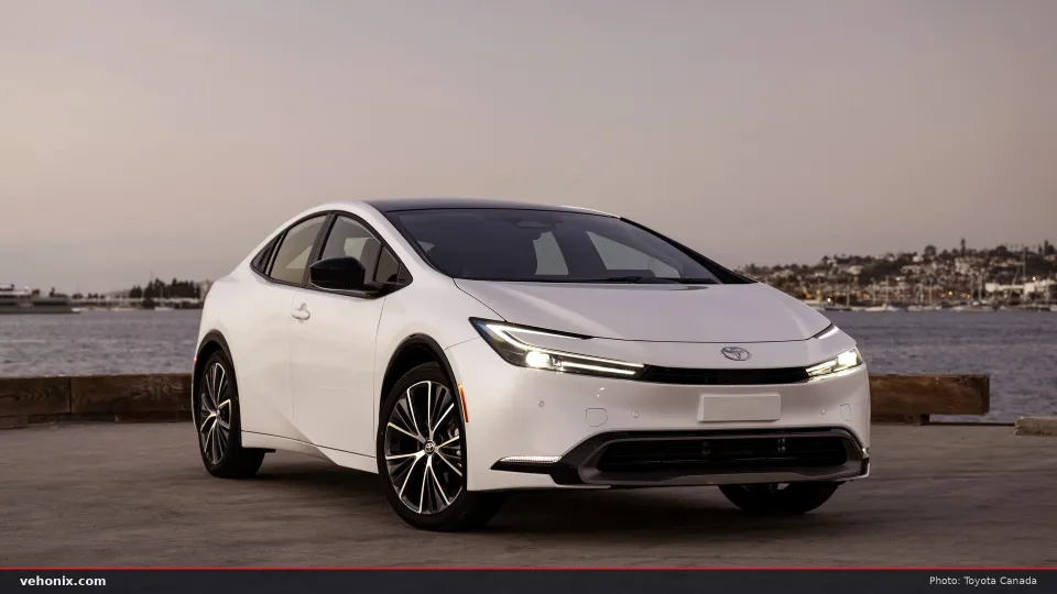2026 Toyota Prius Limited in Wind Chill Pearl, front three-quarter view by the water