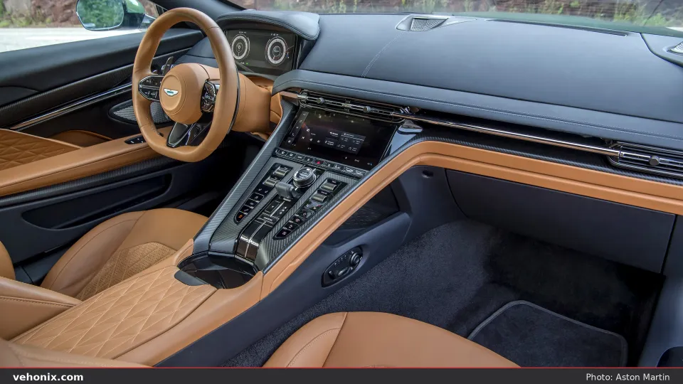 2026 Aston Martin DB12 cabin with tan quilted leather and carbon-fibre centre console