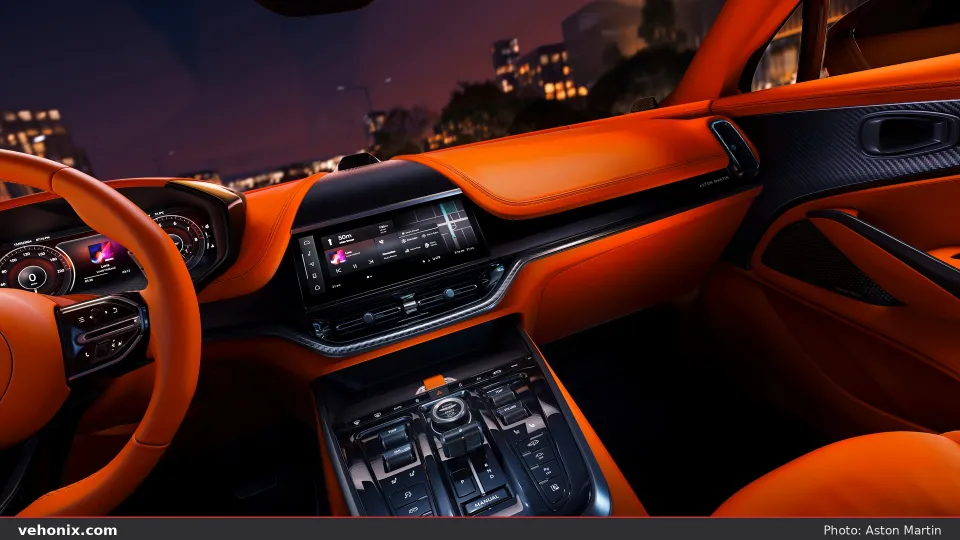 2026 Aston Martin DBX707 cabin with orange leather dashboard and centre touchscreen