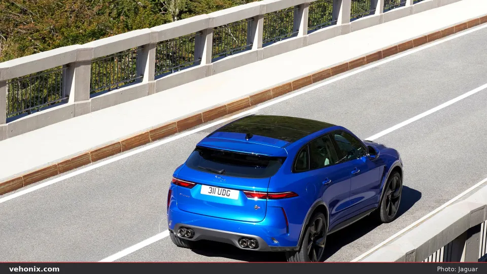 2026 Jaguar F-Pace P550 SVR blue, elevated rear three-quarter on bridge