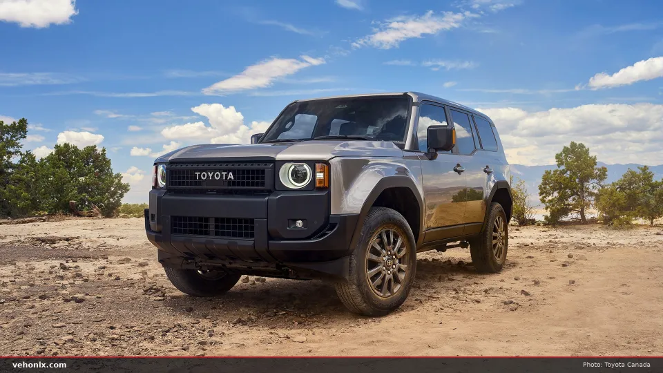 2026 Toyota Land Cruiser 2026 in grey, front three-quarter view on a dirt lot