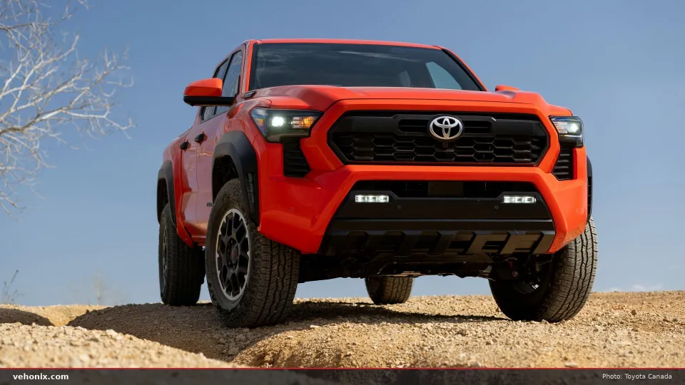 2026 Toyota Tacoma TRD Off-Road in Solar Octane orange, low front view