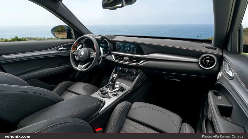 2026 Alfa Romeo Stelvio Intensa cabin with black leather and ocean view ahead