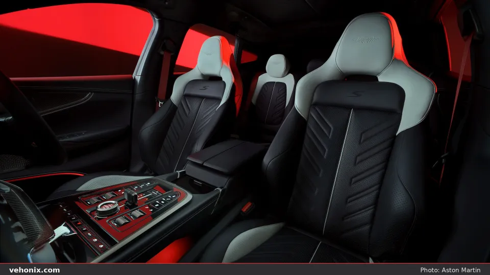 2026 Aston Martin DBX S cabin with black and light-grey seats and red seatbelts