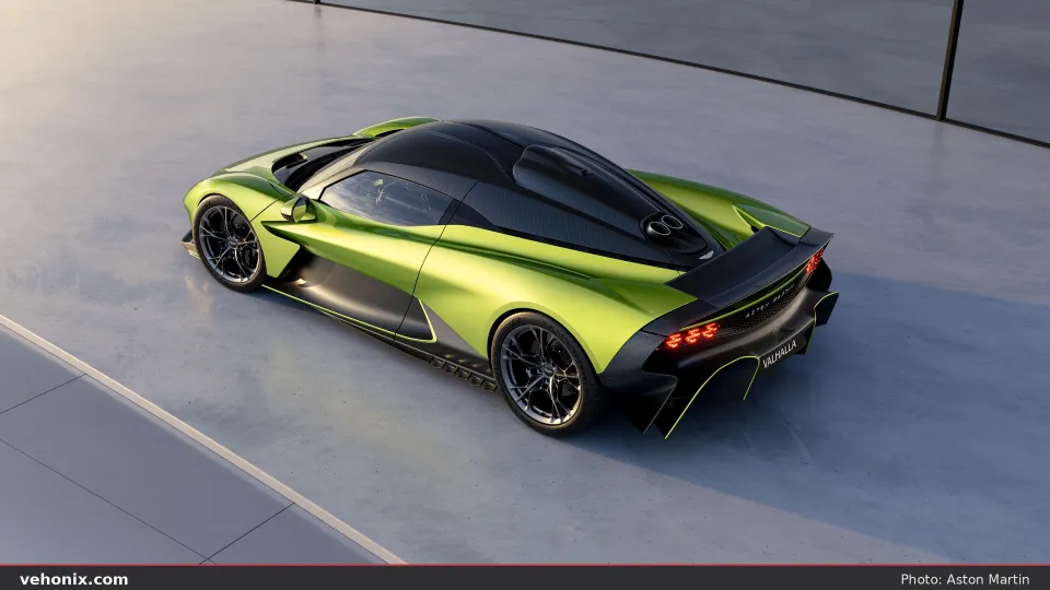 2026 Aston Martin Valhalla in lime green with carbon roof, high-angle rear three-quarter view