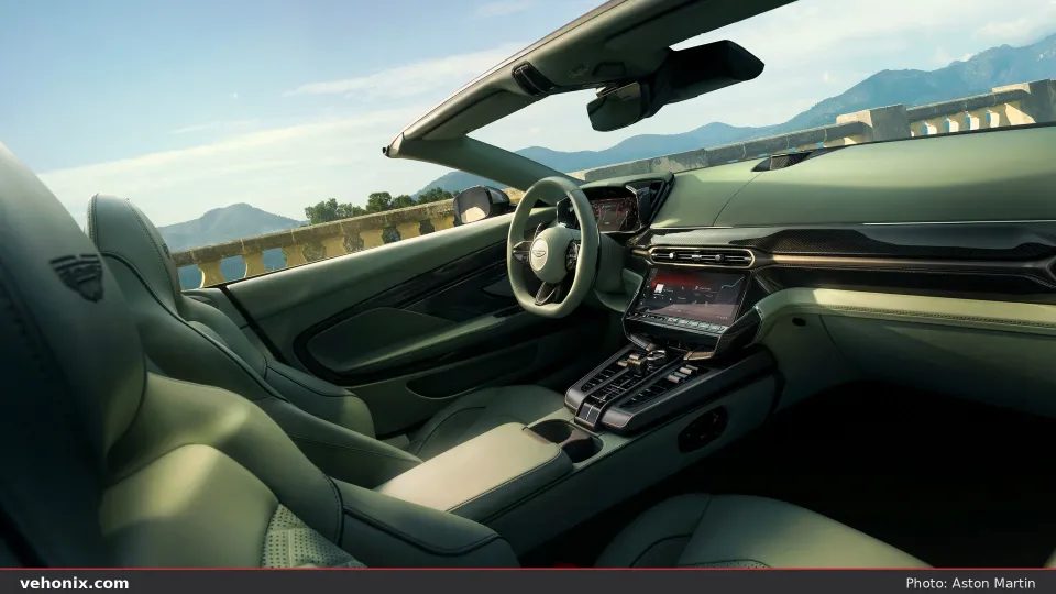 2026 Aston Martin Vanquish Volante open cabin with pale green leather seats, top down