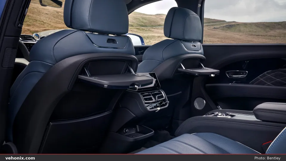 2026 Bentley Bentayga EWB rear cabin with blue leather seats and picnic tables