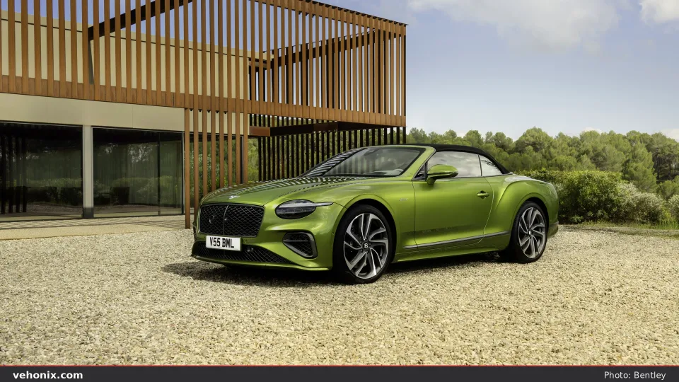 2026 Bentley Continental GT Convertible in green, front three-quarter with top up