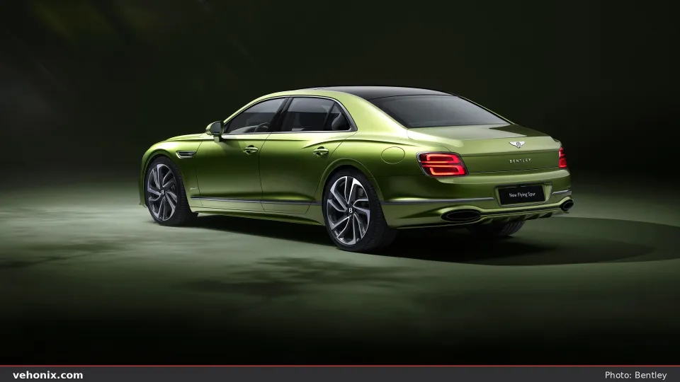 2026 Bentley Flying Spur in metallic green, rear three-quarter studio view