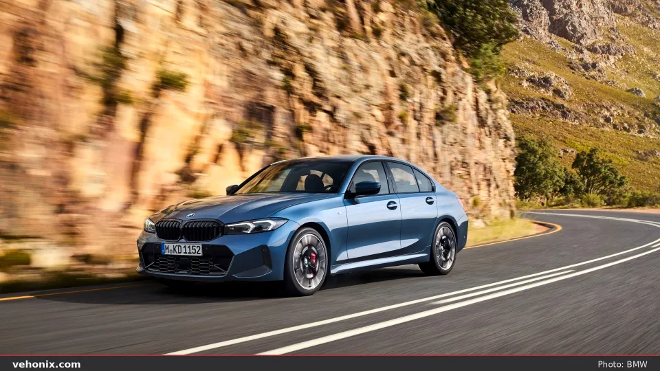 2026 BMW 330i xDrive in orange, exterior view