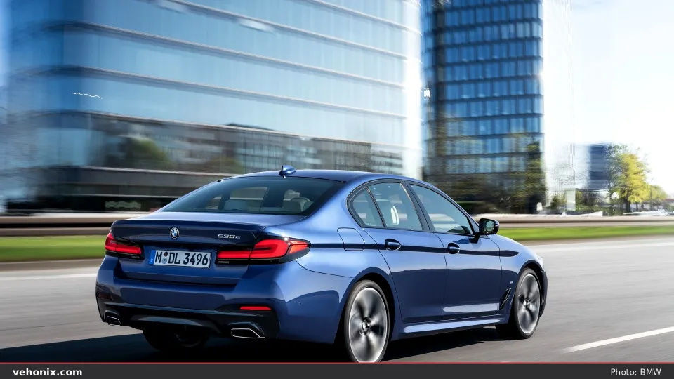 2026 BMW 550e xDrive in blue, exterior view