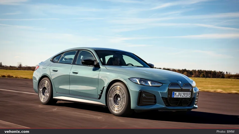 2026 BMW i4 M60 xDrive Gran Coupe in blue, exterior view