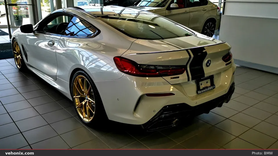 2026 BMW M850i xDrive Gran Coupe in orange, exterior view