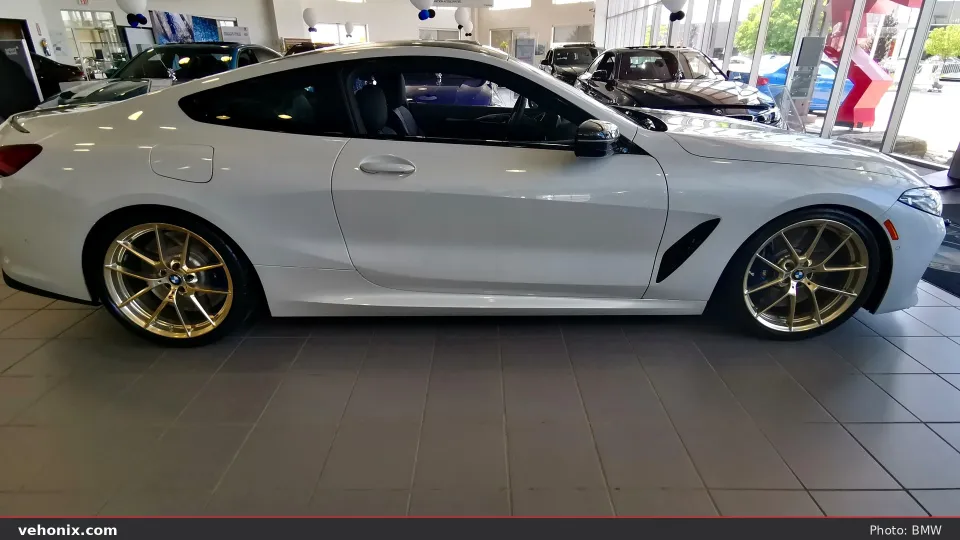 2026 BMW M850i xDrive Gran Coupe in orange, exterior view