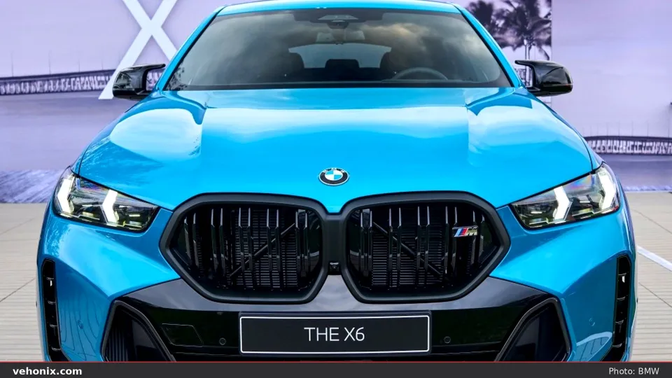 2026 BMW X6 M60i xDrive in blue, exterior view