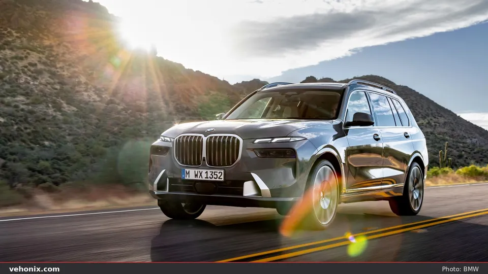2026 BMW X7 xDrive40i in orange, exterior view