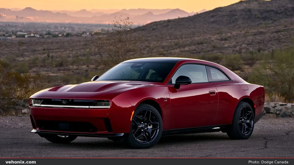 2026 Dodge Charger Daytona R/T in red, front three-quarter at desert dusk