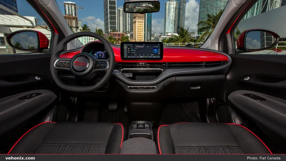 2026 Fiat 500e (RED) cabin with red dash panel, touchscreen and black seats