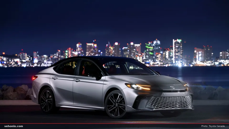 Toyota Camry XSE AWD hybrid sedan in Heavy Metal with a black roof