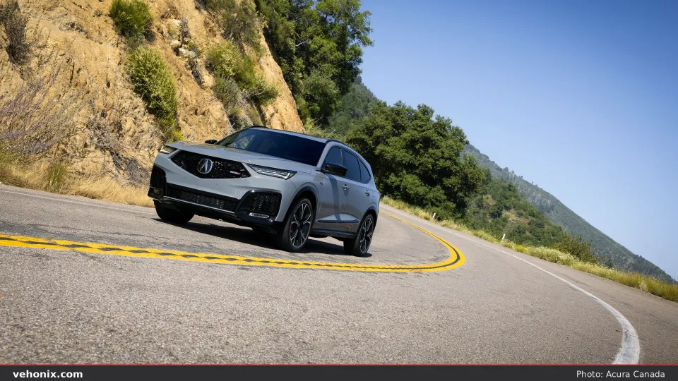 2026 Acura MDX SH-AWD Type S in grey, front three-quarter view on a hillside road