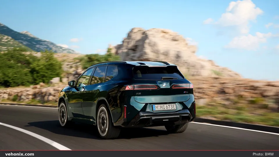 2026 BMW X5 M60i xDrive in orange, exterior view