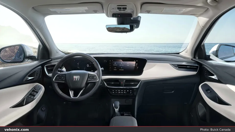 2026 Buick Encore GX cockpit with dual screens and two-tone black-and-cream cabin