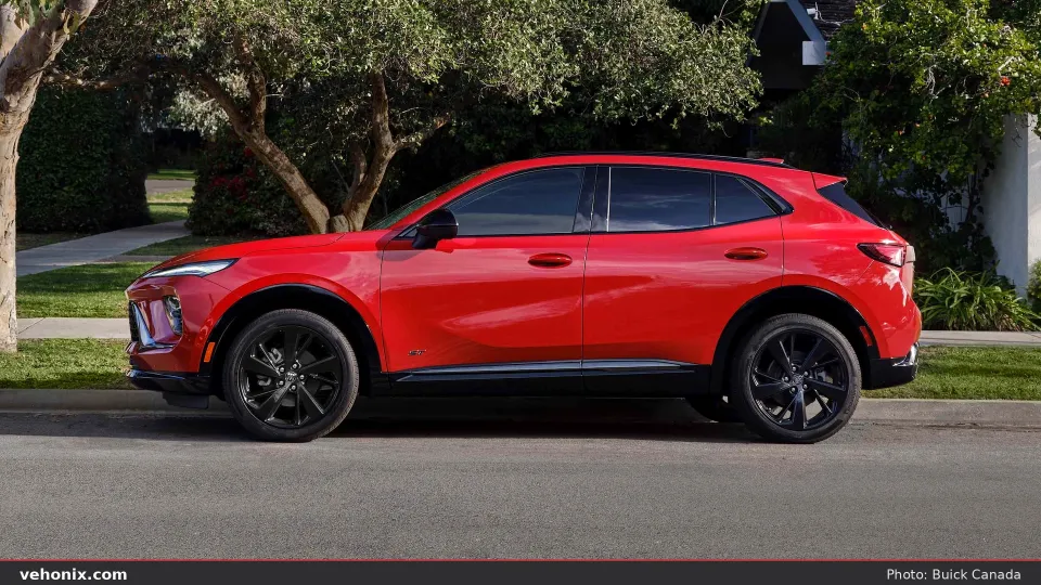 2026 Buick Envision ST in red, full side profile on a residential street