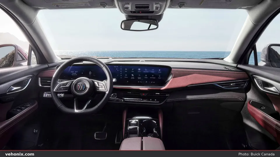 2026 Buick Envision cockpit with ultrawide display and burgundy cabin trim
