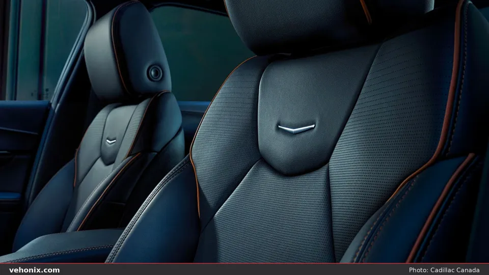 2026 Cadillac CT4 front seats in black with orange contrast stitching and crest badges