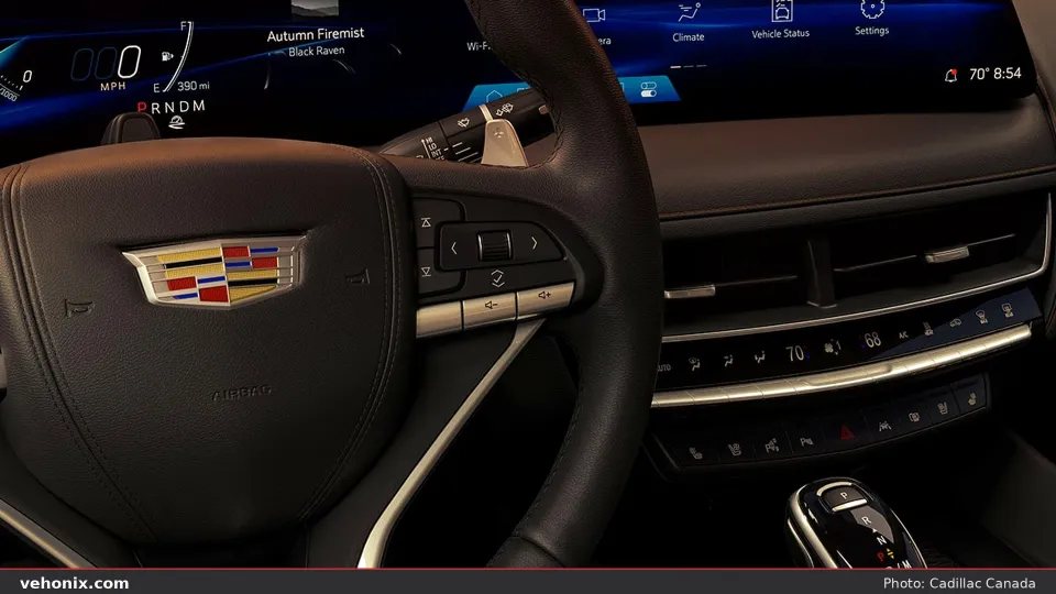 2026 Cadillac CT5 cockpit with leather steering wheel and curved digital display