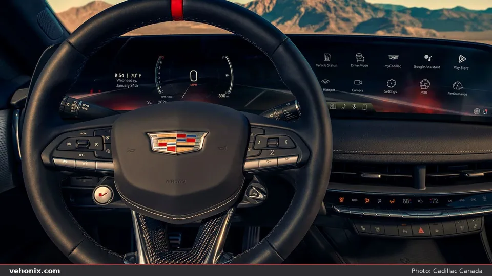 2026 Cadillac CT5-V cockpit with V-mode steering wheel and curved driver display