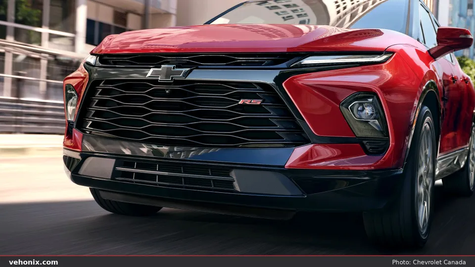 2026 Chevrolet Blazer front grille and LED lights in red on a city street
