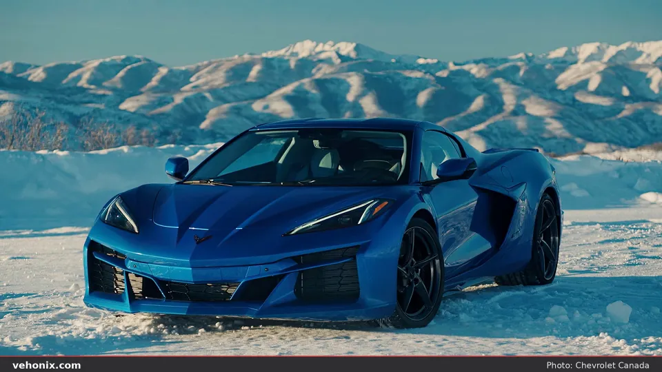2026 Chevrolet Corvette E-Ray in blue, front three-quarter view on snow