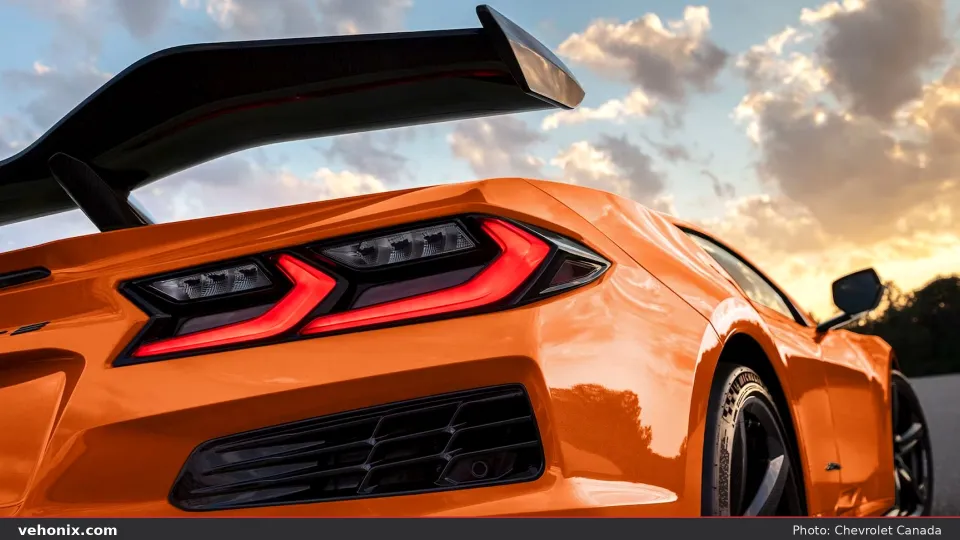 2026 Chevrolet Corvette Z06 Carbon Aero in orange, taillight and rear wing detail