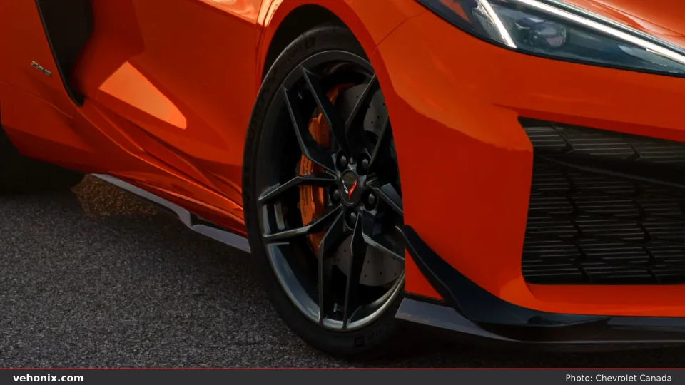 2026 Chevrolet Corvette Z06 in orange, front wheel and side detail