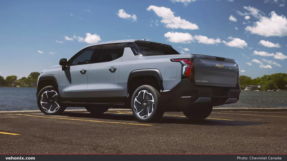 2026 Chevrolet Silverado EV LT Std in light blue, rear three-quarter view