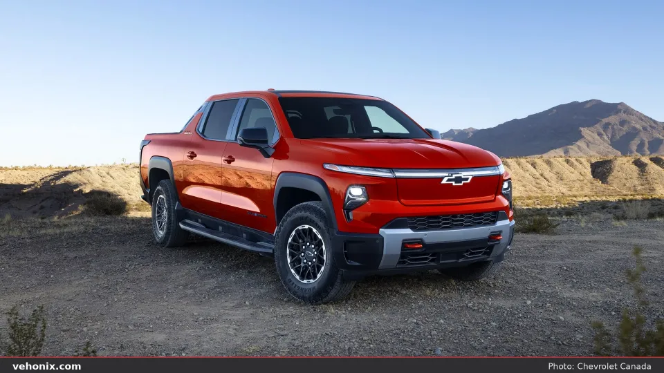 2026 Chevrolet Silverado EV WT Std in red, front three-quarter view