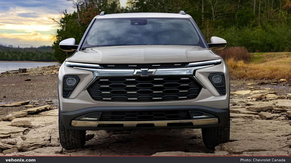 2026 Chevrolet Trailblazer in beige, front view on rocky ground by water