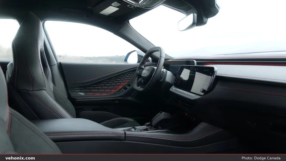 2026 Dodge Charger R/T interior cockpit with digital displays and red stitching