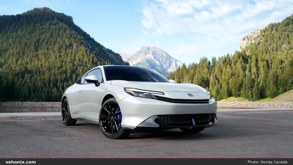 2026 Honda Prelude in white, front three-quarter with mountains behind