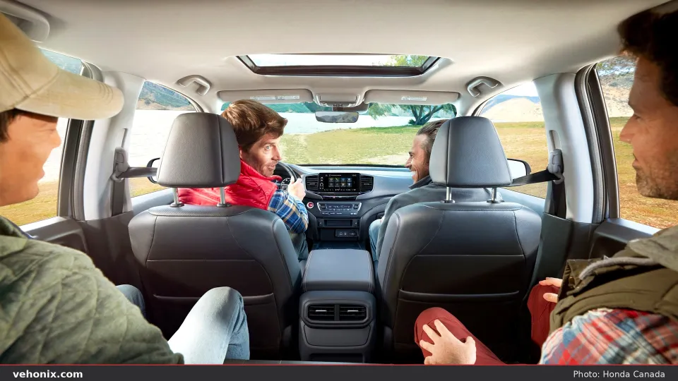2026 Honda Ridgeline black leather cabin with passengers looking forward through cabin