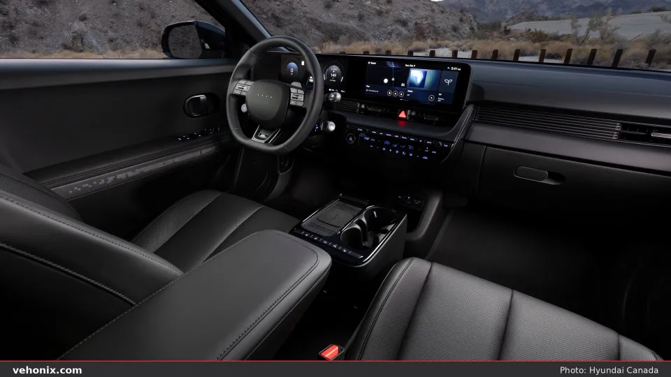 2026 Hyundai IONIQ 5 XRT dual-screen dashboard and dark cabin at dusk