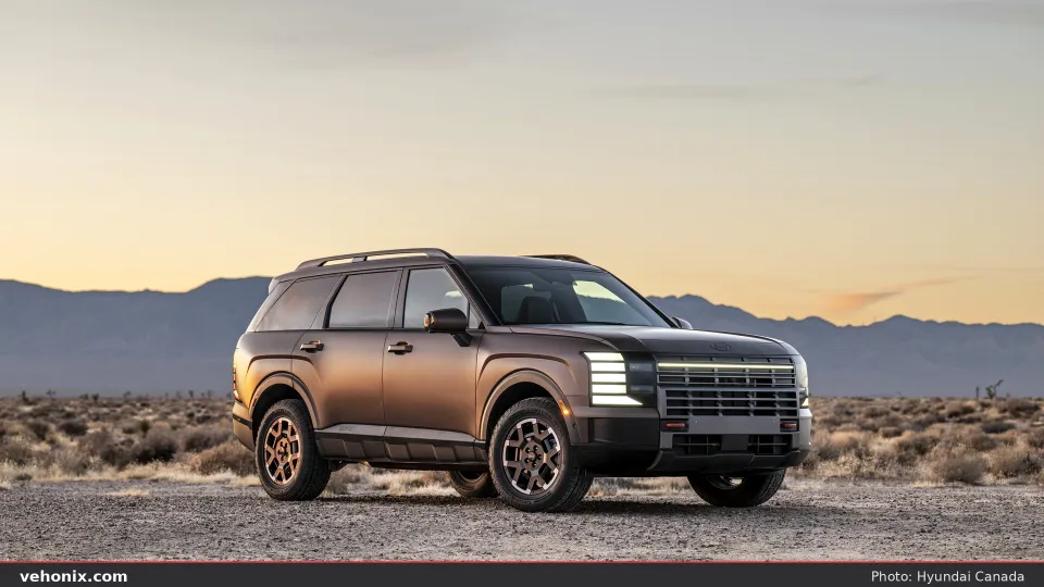 2026 Hyundai Palisade XRT, front three-quarter on light desert gravel