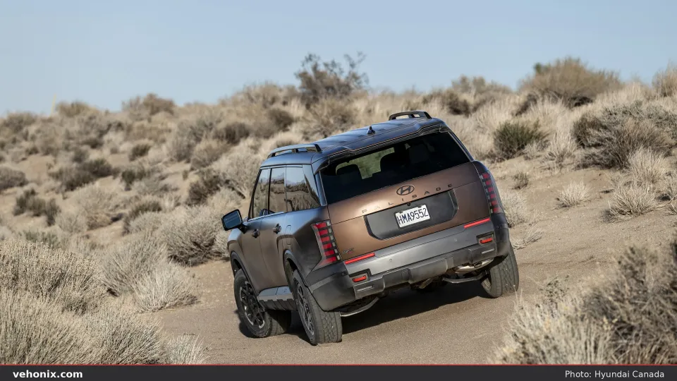 2026 Hyundai Palisade XRT, front three-quarter driving on a paved road