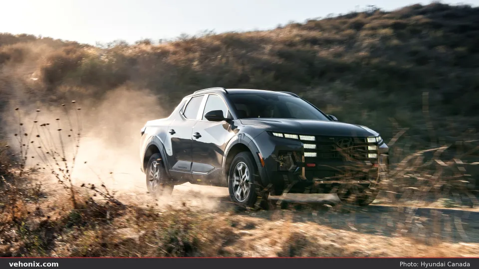 2026 Hyundai Santa Cruz XRT, front three-quarter kicking up dust on a trail
