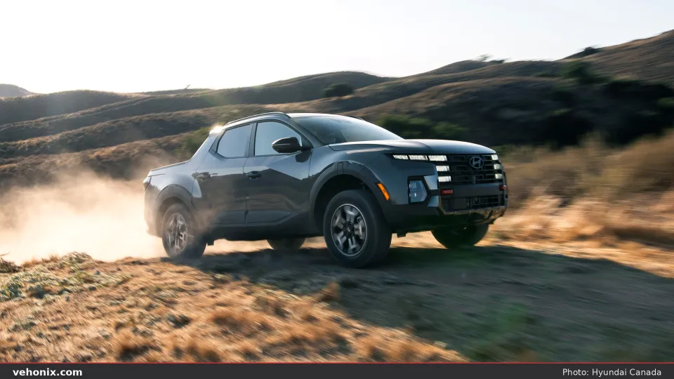 2026 Hyundai Santa Cruz XRT, rear three-quarter on a dirt trail at dusk